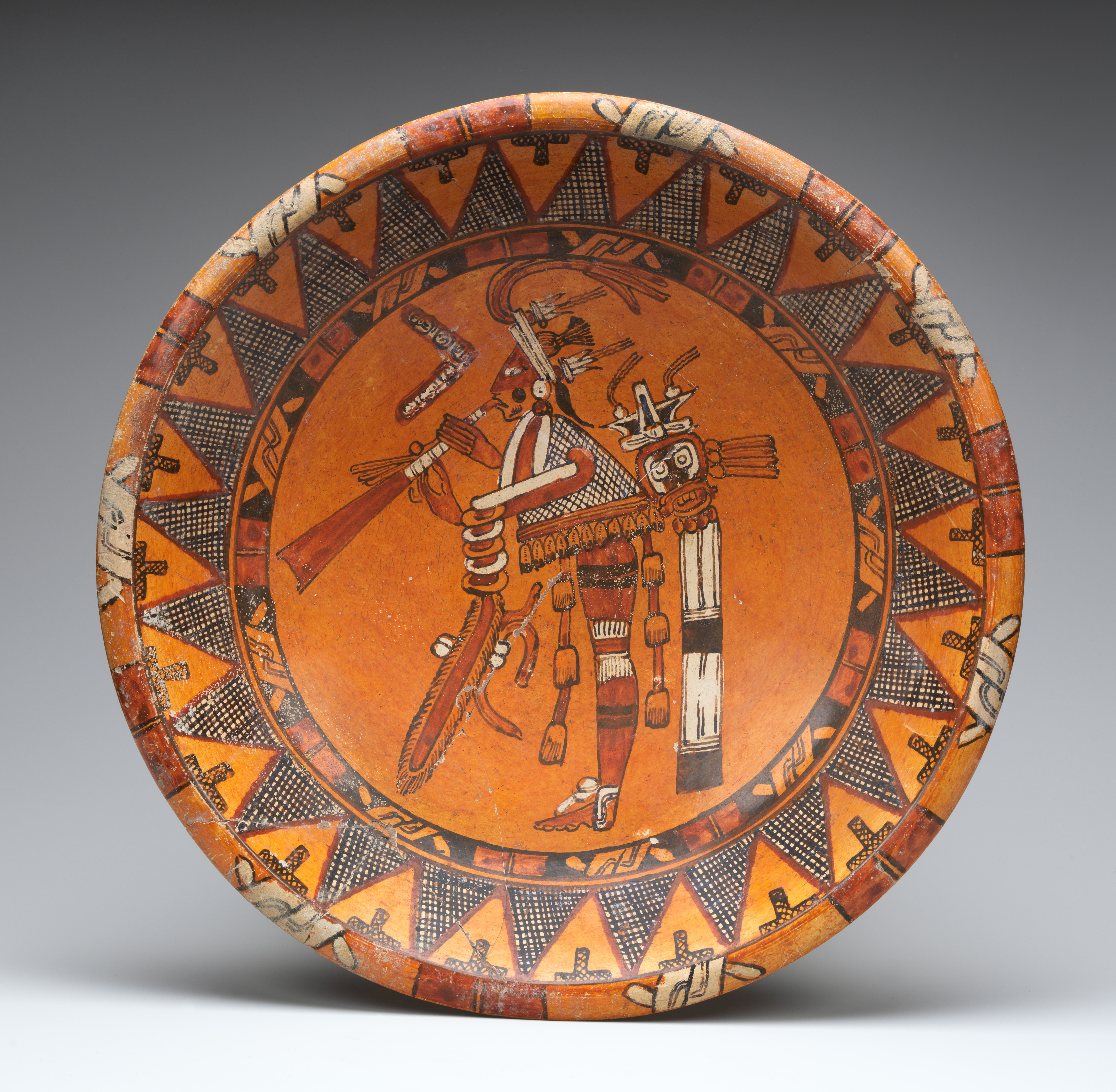 Plate with trumpeter